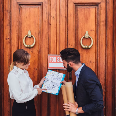 real-estate-agent-architect-with-wooden-door_23-2147650194